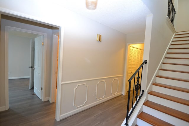 14459 Misty Meadow Ln, Houston, TX 77079 - stairs featuring wood finished floors and baseboards