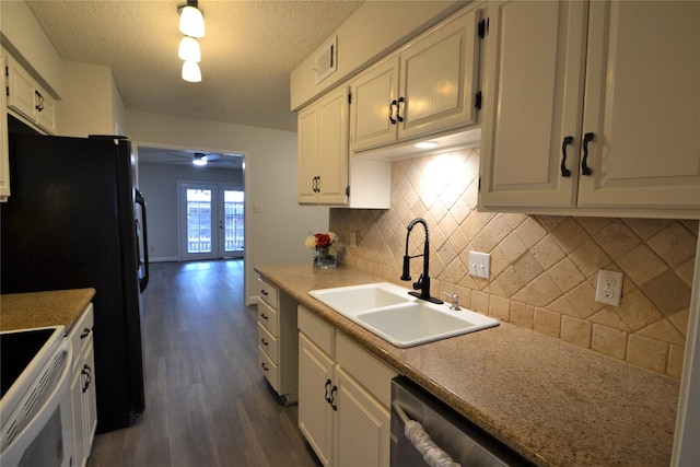 14459 Misty Meadow Ln, Houston, TX 77079 - kitchen featuring dark wood-type flooring, a sink, tasteful backsplash, white cabinetry, and a textured ceiling