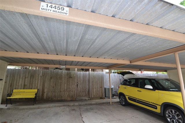 14459 Misty Meadow Ln, Houston, TX 77079 - covered parking lot featuring fence