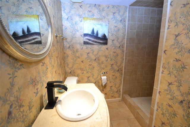 14459 Misty Meadow Ln, Houston, TX 77079 - bathroom with a sink, tile patterned flooring, walk in shower, baseboards, and wallpapered walls