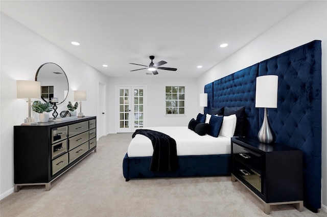 bedroom featuring light carpet, recessed lighting, baseboards, and a ceiling fan