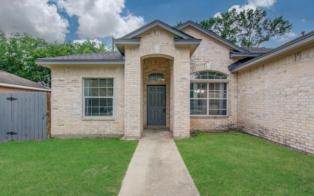 3116 Grassmere St, Houston, TX 77051 - view of front of property with a front lawn, brick siding, and a shingled roof