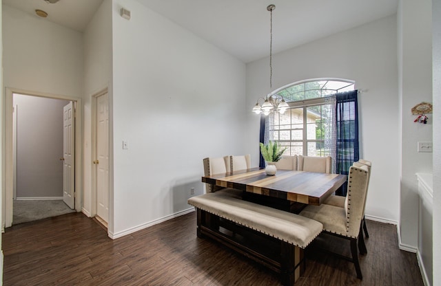 3116 Grassmere St, Houston, TX 77051 - dining area featuring dark wood finished floors, a chandelier, a high ceiling, and baseboards