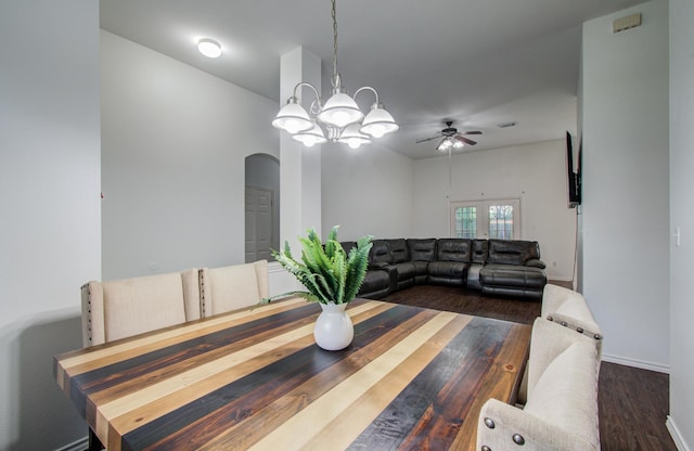 3116 Grassmere St, Houston, TX 77051 - dining room featuring arched walkways, baseboards, a chandelier, ceiling fan, and dark wood-style flooring