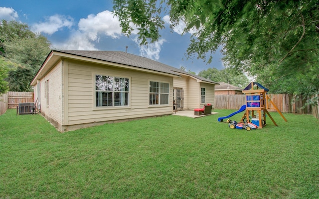 3116 Grassmere St, Houston, TX 77051 - rear view of house featuring central AC unit, a playground, and a patio