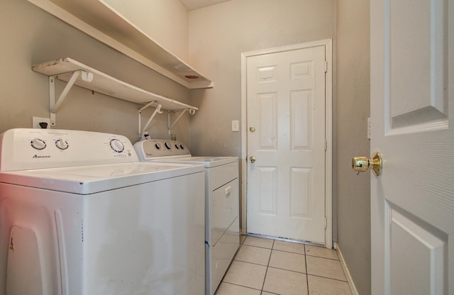 3116 Grassmere St, Houston, TX 77051 - washroom featuring washing machine and dryer, light tile patterned flooring, and baseboards