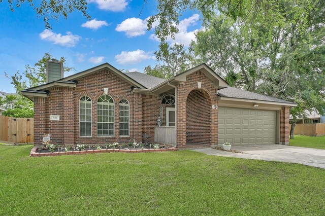 ranch-style home with brick siding, concrete driveway, an attached garage, and a chimney