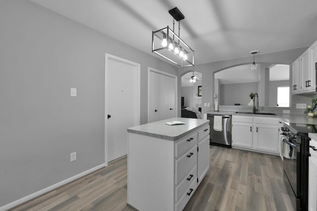 kitchen with a sink, black range with electric cooktop, dishwasher, wood finished floors, and a center island