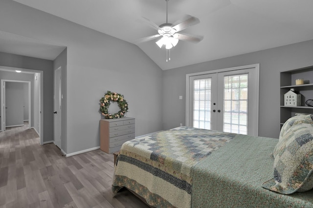 bedroom with french doors, vaulted ceiling, wood finished floors, baseboards, and ceiling fan