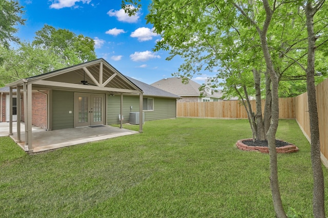 back of property with french doors, a patio, and cooling unit