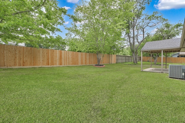 view of yard featuring a patio and central AC