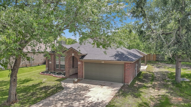 view of front of home with a garage, brick siding, driveway, and roof with shingles