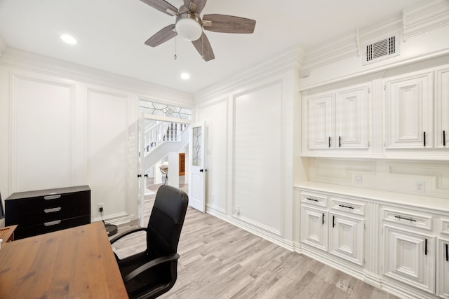 office space with a ceiling fan and light wood-style floors