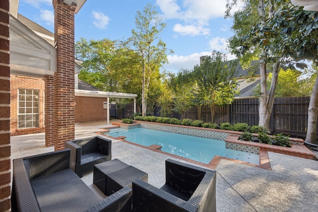 view of swimming pool featuring a patio area, a fenced backyard, and an outdoor hangout area