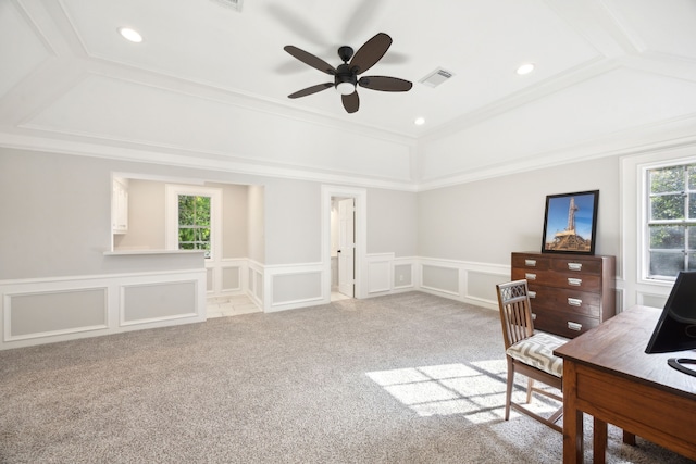 office area featuring a decorative wall, a wainscoted wall, carpet, a ceiling fan, and ornamental molding