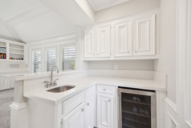 bar area with wine cooler, a sink, and carpet flooring