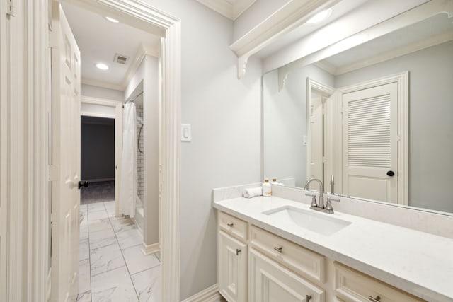 bathroom with marble finish floors, baseboards, ornamental molding, vanity, and recessed lighting