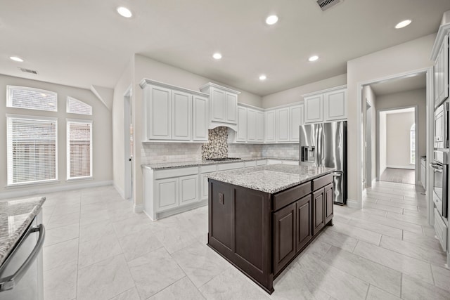 28209 Regal Wood Ct, Spring, TX 77386 - kitchen with stainless steel appliances, tasteful backsplash, baseboards, recessed lighting, and dark brown cabinetry