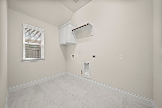 28209 Regal Wood Ct, Spring, TX 77386 - laundry area with electric dryer hookup, cabinet space, baseboards, hookup for a washing machine, and light marble finish floors