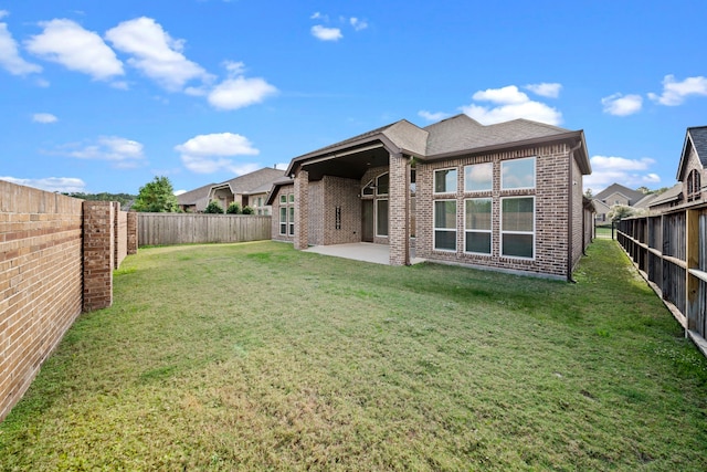 28209 Regal Wood Ct, Spring, TX 77386 - back of property with brick siding, a patio area, and a shingled roof