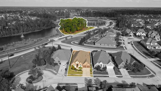 28209 Regal Wood Ct, Spring, TX 77386 - aerial perspective of suburban area featuring a nearby body of water and property parcel outlined
