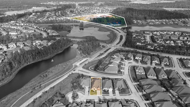 28209 Regal Wood Ct, Spring, TX 77386 - aerial view of residential area featuring a nearby body of water, property boundaries highlighted, and a forest