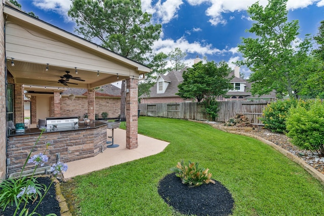 2130 White Eagle Ln, Katy, TX 77450 - view of yard with exterior kitchen, ceiling fan, and a patio