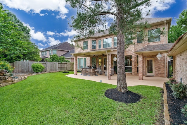 2130 White Eagle Ln, Katy, TX 77450 - back of house with brick siding, a patio, and ceiling fan