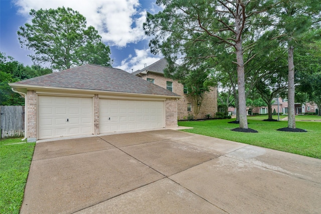 2130 White Eagle Ln, Katy, TX 77450 - view of front of home with brick siding, roof with shingles, and a detached garage