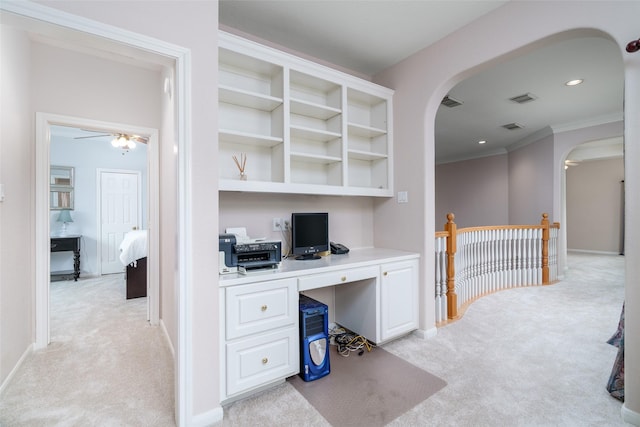 2130 White Eagle Ln, Katy, TX 77450 - unfurnished office featuring light colored carpet, arched walkways, ceiling fan, crown molding, and baseboards