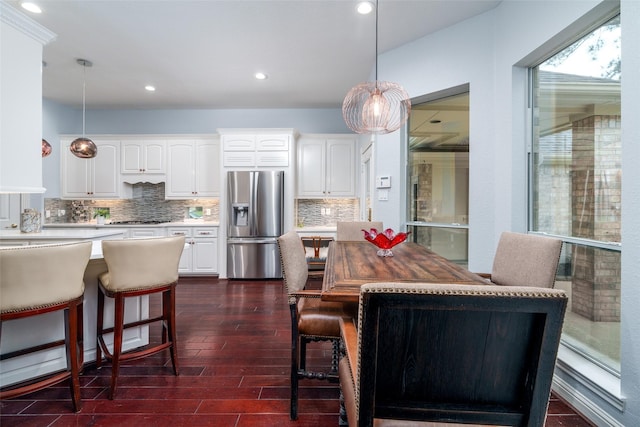 2130 White Eagle Ln, Katy, TX 77450 - kitchen featuring appliances with stainless steel finishes, a kitchen bar, white cabinetry, and recessed lighting