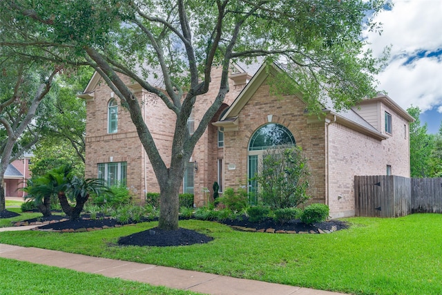 2130 White Eagle Ln, Katy, TX 77450 - traditional home featuring brick siding and a chimney