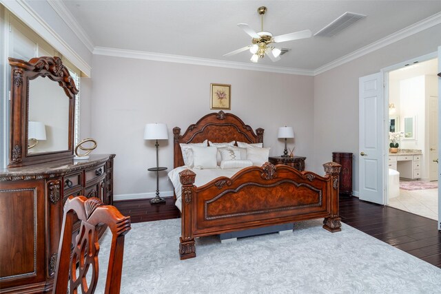 2130 White Eagle Ln, Katy, TX 77450 - bedroom featuring wood finished floors, crown molding, baseboards, ensuite bath, and ceiling fan