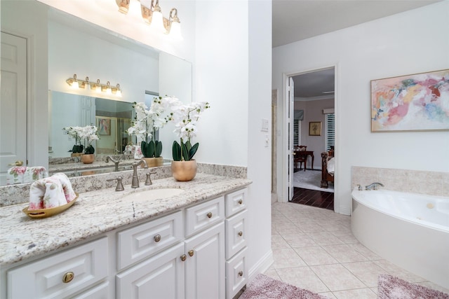2130 White Eagle Ln, Katy, TX 77450 - full bathroom with vanity, tile patterned floors, a bath, a stall shower, and baseboards