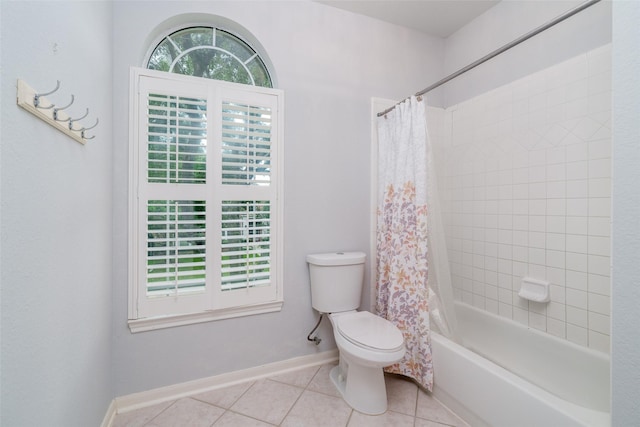 2130 White Eagle Ln, Katy, TX 77450 - bathroom featuring tile patterned flooring, toilet, shower / tub combo, and baseboards