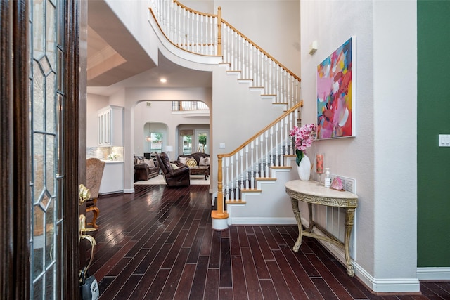 2130 White Eagle Ln, Katy, TX 77450 - foyer featuring baseboards, wood finished floors, stairway, and a towering ceiling