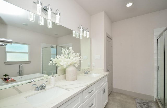 full bath featuring a stall shower, wood finished floors, double vanity, a freestanding bath, and recessed lighting