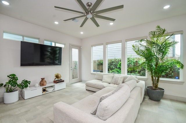 living room with ceiling fan and recessed lighting