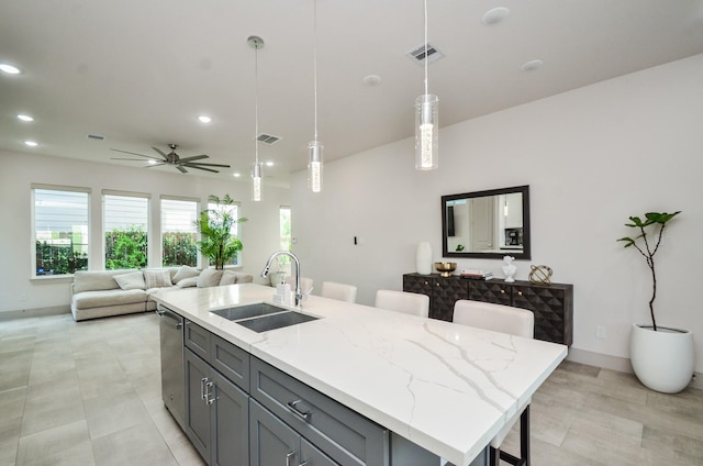 kitchen featuring a sink, stainless steel dishwasher, gray cabinetry, recessed lighting, and a ceiling fan