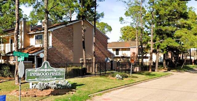 view of property with fence