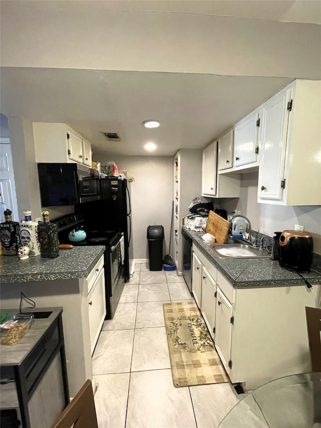 kitchen with electric stove, a sink, dark countertops, and white cabinets
