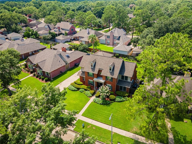 aerial view of residential area with a forest