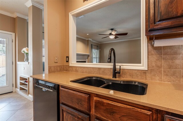 kitchen featuring dishwashing machine, a sink, light countertops, ceiling fan, and ornamental molding