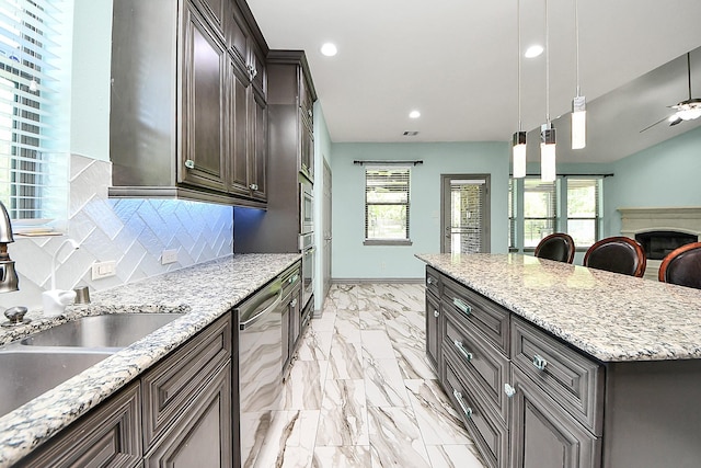 kitchen with a sink, dishwasher, light marble finish floors, decorative backsplash, and healthy amount of natural light
