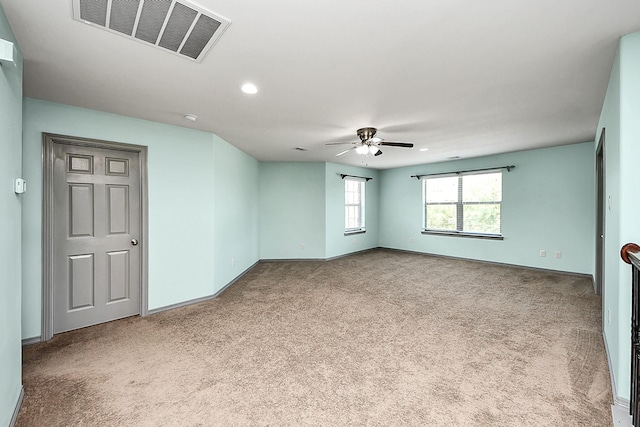 carpeted empty room with a ceiling fan, recessed lighting, and baseboards