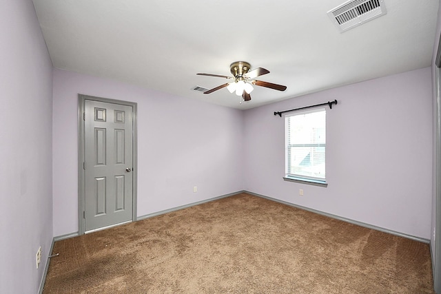 unfurnished room featuring a ceiling fan, carpet flooring, and baseboards