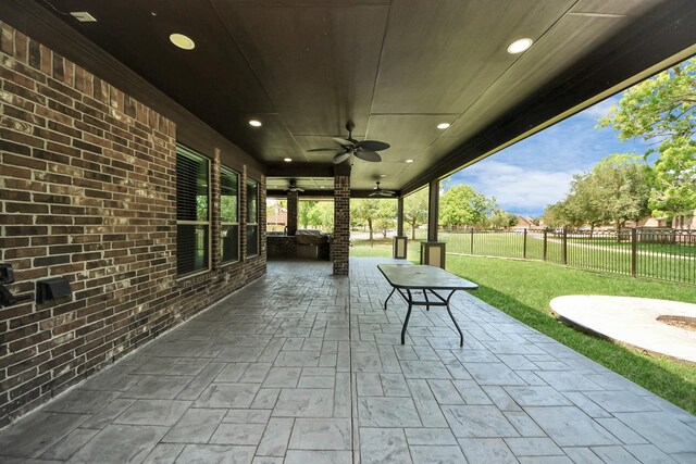 view of patio featuring ceiling fan