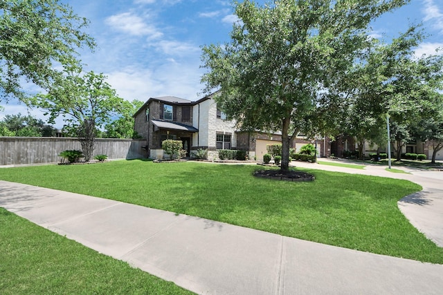 view of front facade featuring driveway, a garage, stone siding, and brick siding