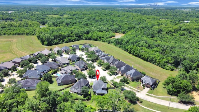 aerial perspective of suburban area with a forest