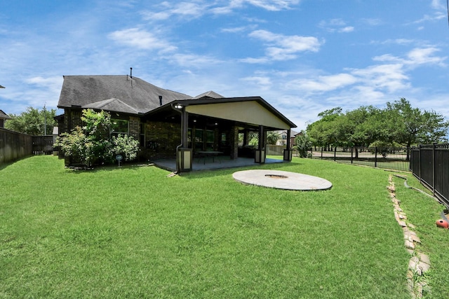 view of yard featuring a patio area and an outdoor fire pit